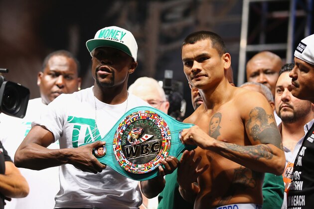 LAS VEGAS, NV - SEPTEMBER 12:  WBC/WBA welterweight champion Floyd Mayweather Jr. (L) and Marcos Maidana pose during their official weigh-in at the MGM Grand Garden Arena on September 12, 2014 in Las Vegas, Nevada. Mayweather Jr. will defend his titles against Maidana on September 13 in Las Vegas.  (Photo by Al Bello/Getty Images)