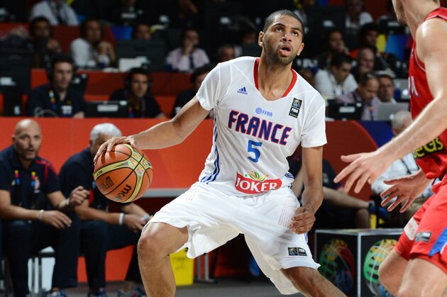 MADRID, SPAIN - SEPTEMBER 12: Nicolas Batum #5 of the France National Team looks to shoot against the Serbia National Team at Palacio de Deportes on September 12, 2014 in Madrid, Spain.  NOTE TO USER: User expressly acknowledges and agrees that, by downloading and/or using this Photograph, user is consenting to the terms and conditions of the Getty Images License Agreement. Mandatory Copyright Notice: Copyright 2014 NBAE (Photo by Garrett Ellwood/NBAE via Getty Images)