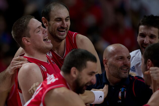 MADRID, SPAIN - SEPTEMBER 12:  Vladimir Stimac (L) of Serbia celebrates embraced with his teammate  Nenad Krstic (2ndL) their victory against France with their teammates and head coach Sasha Djordjevic (2ndR) after the 2014 FIBA World Basketball Championship semifinal match between France and Serbia at Palacio de los Deportes on September 12, 2014 in Madrid, Spain.  (Photo by Gonzalo Arroyo Moreno/Getty Images)