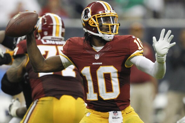 HOUSTON, TX - SEPTEMBER 07:  Robert Griffin III #10 of the Washington Redskins throws down-field in the fourth quarter against the Houston Texans at Reliant Stadium on September 7, 2014 in Houston, Texas.  (Photo by Bob Levey/Getty Images)