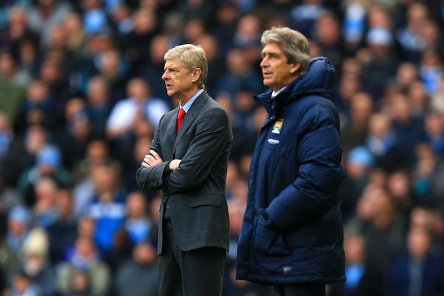 MANCHESTER, ENGLAND - DECEMBER 14:  Arsene Wenger manager of Arsenal and Manuel Pellegrini manager of Manchester City look on during the Barclays Premier League match between Manchester City and Arsenal at Etihad Stadium on December 14, 2013 in Manchester, England.  (Photo by Richard Heathcote/Getty Images)