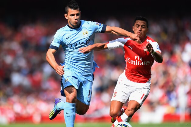 LONDON, ENGLAND - SEPTEMBER 13:  Sergio Aguero of Manchester City and Alexis Sanchez of Arsenal battle for the ball during the Barclays Premier League match between Arsenal and Manchester City at Emirates Stadium on September 13, 2014 in London, England.  (Photo by Shaun Botterill/Getty Images)