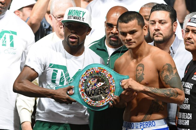 LAS VEGAS, NV - SEPTEMBER 12:  WBC/WBA welterweight champion Floyd Mayweather Jr. (L) and Marcos Maidana pose during their official weigh-in at the MGM Grand Garden Arena on September 12, 2014 in Las Vegas, Nevada. Mayweather Jr. will defend his titles against Maidana on September 13 in Las Vegas.  (Photo by Ethan Miller/Getty Images)