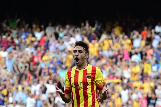 FC Barcelona's Munir El Haddadi Mohamed gestures during a Spanish La Liga soccer match against Athletic Bilbao at the Camp Nou stadium in Barcelona, Spain, Saturday, Sept. 13, 2014. (AP Photo/Manu Fernandez)