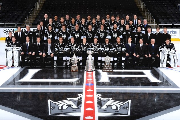 LOS ANGELES, CA - JUNE 16:  The Los Angeles Kings pose for a team picture with the Stanley Cup Trophy, the Conn Smythe Trophy and the Campbell Cup before the Los Angeles Kings victory parade and rally on June 16, 2014 in Los Angeles, California. (Photo by Noah Graham/NHLI via Getty Images)