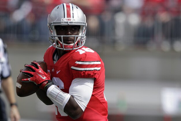 Ohio State quarterback J.T. Barrett drops back to pass against Kent State during the first quarter of an NCAA college football game Saturday, Sept. 13, 2014, in Columbus, Ohio. (AP Photo/Jay LaPrete)