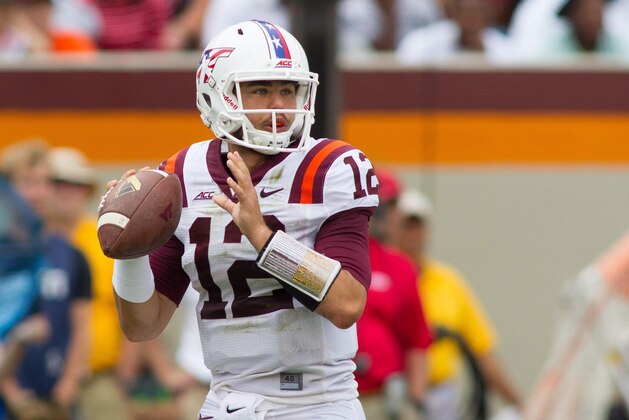 Sep 13, 2014; Blacksburg, VA, USA; Virginia Tech Hokies quarterback Michael Brewer (12) looks to pass the ball during the second quarter against the East Carolina Pirates  at Lane Stadium. Mandatory Credit: Jeremy Brevard-USA TODAY Sports