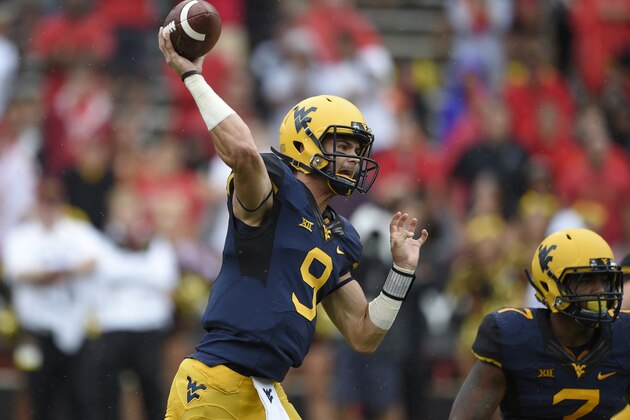 West Virginia quarterback Clint Trickett (9) passes against Maryland during the first half of an NCAA football game, Saturday, Sept. 13, 2014, in College Park, Md. (AP Photo/Nick Wass) West Virginia quarterback Clint Trickett (9) passes against Maryland during the first half of an NCAA football game, Saturday, Sept. 13, 2014, in College Park, Md. (AP Photo/Nick Wass)