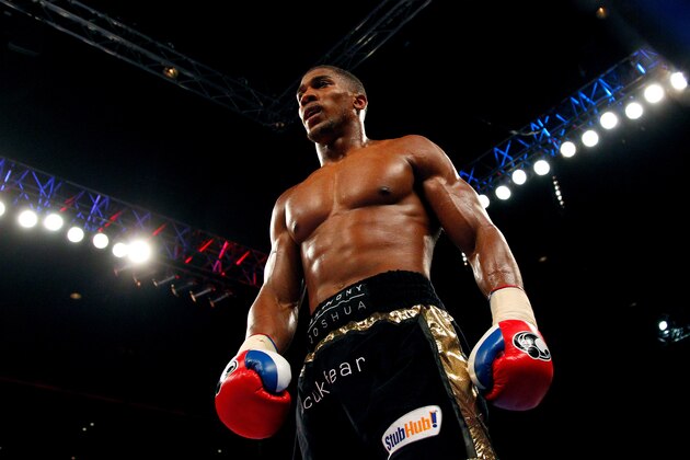 LIVERPOOL, ENGLAND - JULY 12:  Anthony Joshua in action with Matt Skelton during their Heavyweight Contest fight at the Liverpool Echo Arena on July 12, 2014 in Liverpool, England. (Photo by Paul Thomas/Getty Images)