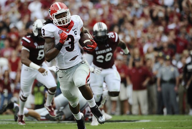 Georgia running back Todd Gurley (3) runs for a touchdown during the first half of an NCAA college football game against South Carolina on Saturday, Sept. 13, 2014, in Columbia, S.C. The touchdown as called back because of a holding penalty on Georgia. (AP Photo/Rainier Ehrhardt)
