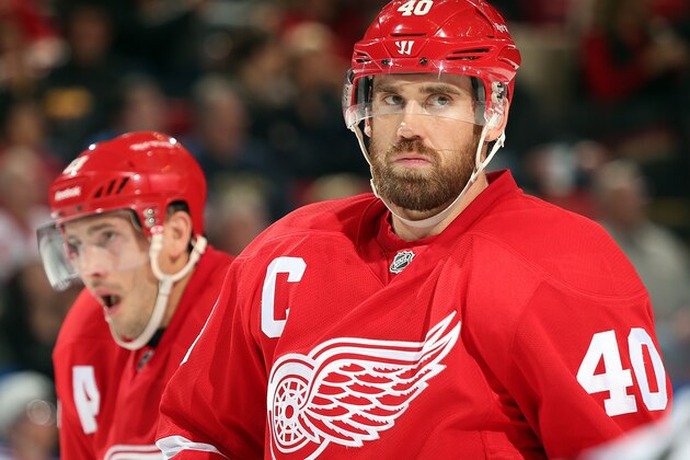 DETROIT, MI - OCTOBER 26: Henrik Zetterberg #40 and Pavel Datsyuk #13 of the Detroit Red Wings gets set for the face-off during an NHL game against the New York Rangers at Joe Louis Arena on October 26, 2013 in Detroit, Michigan. The Rangers win in O.T. 3-2 (Photo by Dave Reginek/NHLI via Getty Images)