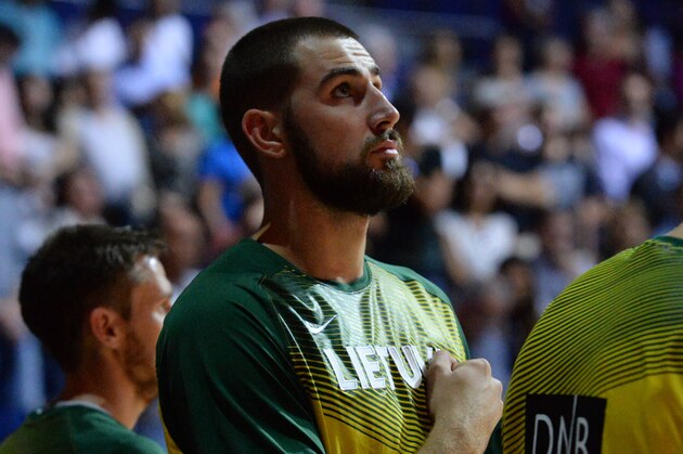 MADRID, SPAIN - SEPTEMBER 13: Jonas Valanciunas #14 of the Lithuania National Team stands for the National Anthem the France National Team at Palacio de Deportes on September 13, 2014 in Madrid, Spain.  NOTE TO USER: User expressly acknowledges and agrees that, by downloading and/or using this Photograph, user is consenting to the terms and conditions of the Getty Images License Agreement. Mandatory Copyright Notice: Copyright 2014 NBAE (Photo by Jesse D. Garrabrant/NBAE via Getty Images)