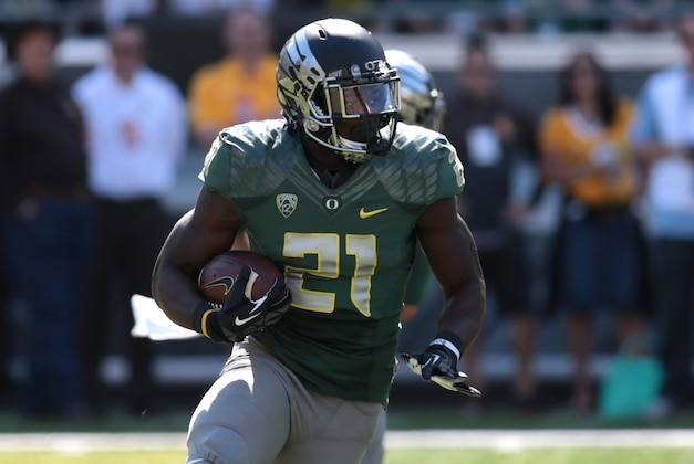Sep 13, 2014; Eugene, OR, USA; Oregon Ducks running back Royce Freeman (21) runs the ball in the second half against the Wyoming Cowboys at Autzen Stadium. Mandatory Credit: Scott Olmos-USA TODAY Sports