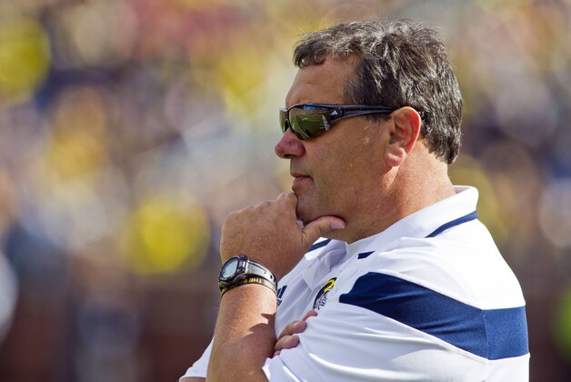 Michigan head coach Brady Hoke watches from the sideline in the second quarter of an NCAA college football game against Miami (Ohio) in Ann Arbor, Mich., Saturday, Sept. 13, 2014. (AP Photo/Tony Ding)