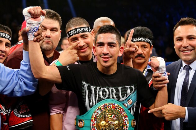 LAS VEGAS, NV - SEPTEMBER 13:  Leo Santa Cruz celebrates after a second round TKO victory of Manuel Roman during their WBC super bantamweight title fight at the MGM Grand Garden Arena on September 13, 2014 in Las Vegas, Nevada.  (Photo by Al Bello/Getty Images)