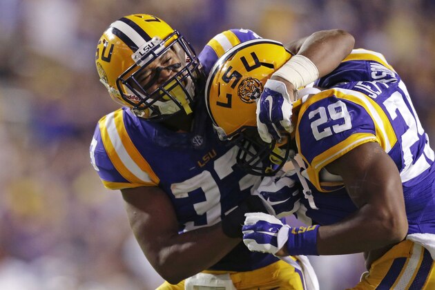 LSU safety Jamal Adams (33) and safety Rickey Jefferson (29) celebrate a defensive stop in the second half of an NCAA college football game against Louisiana-Monroe in Baton Rouge, La., Saturday, Sept. 13, 2014. LSU won 31-0. (AP Photo/Gerald Herbert)