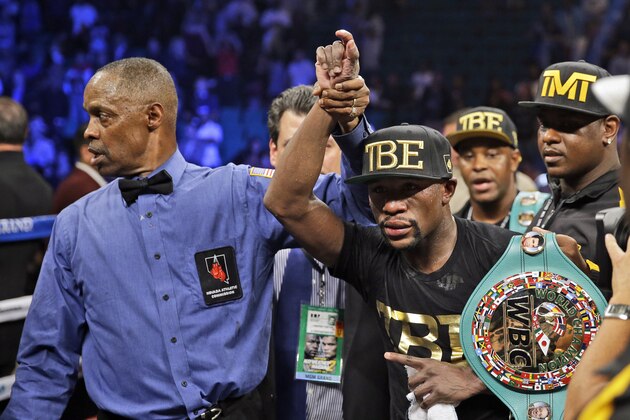 Floyd Mayweather shows off his belts after beating Marcos Maidana during their WBA welterweight and WBC super welterweight title fight, Saturday, Sept. 13, 2014, in Las Vegas. (AP Photo/John Locher) Floyd Mayweather shows off his belts after beating Marcos Maidana during their WBA welterweight and WBC super welterweight title fight, Saturday, Sept. 13, 2014, in Las Vegas. (AP Photo/John Locher)