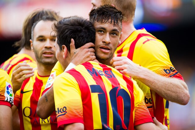 BARCELONA, SPAIN - SEPTEMBER 13: Neymar Santos Jr of FC Barcelona is congratulated by his teammates after scoring his second team's goal during the La Liga match between FC Barcelona and Athletic Club at Camp Nou on September 13, 2014 in Barcelona, Spain. (Photo by Alex Caparros/Getty Images)