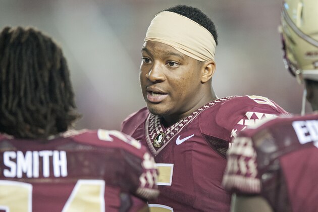 TALLAHASSEE, FL - SEPTEMBER 6: Florida State Seminole Quaterback Jameis Winston #12 talks to fellow players during the second half at Doak Campbell Stadium on September 6, 2014 in Tallahassee, Florida.  The Seminoles took the Bulldogs 37-12(Photo by Jeff Gammons/Getty Images)