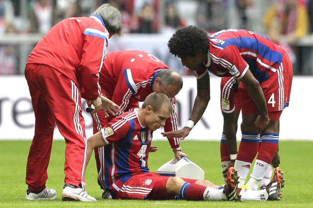 Bayern's Holger Badstuber sits injured on the ground during the German first division Bundesliga soccer match between FC Bayern Munich and VfB Stuttgart in the Allianz Arena in Munich, Germany, on Saturday, Sept. 13, 2014. (AP Photo/Matthias Schrader) Bayern's Holger Badstuber sits injured on the ground during the German first division Bundesliga soccer match between FC Bayern Munich and VfB Stuttgart in the Allianz Arena in Munich, Germany, on Saturday, Sept. 13, 2014. (AP Photo/Matthias Schrader)