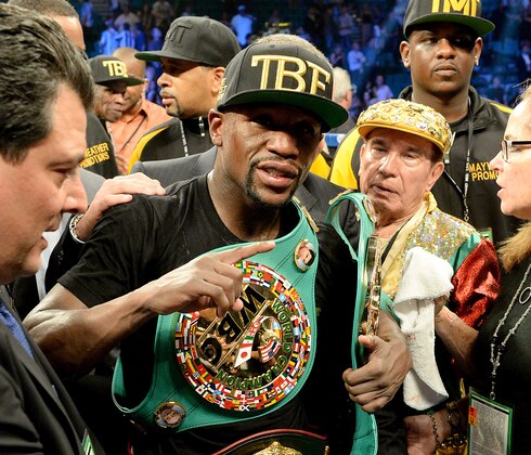 Sep 13, 2014; Las Vegas, NV, USA; Floyd Mayweather celebrates in the ring after defeating Marcos Maidana (not pictured) in their WBC & WBA Welterweight and WBC Superwelter Weight title fight at the MGM Grand Garden Arena. Mandatory Credit: Jayne Kamin-Oncea-USA TODAY Sports