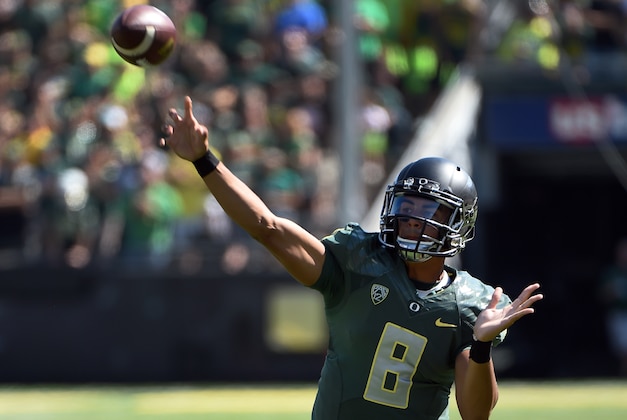 Oregon quarterback Marcus Mariota (8) passes the ball during the second quarter against Wyoming during an NCAA college football game at Autzen Stadium, Saturday, Sept. 13, 2014, in Eugene, Ore. (AP Photo/Steve Dykes) Oregon quarterback Marcus Mariota (8) passes the ball during the second quarter against Wyoming during an NCAA college football game at Autzen Stadium, Saturday, Sept. 13, 2014, in Eugene, Ore. (AP Photo/Steve Dykes)