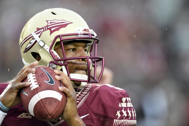 Sep 6, 2014; Tallahassee, FL, USA;  Florida State Seminoles quarterback Jameis Winston (5) warms up during passing drills before their game against the Citadel Bulldogs at Doak Campbell Stadium. Mandatory Credit: John David Mercer-USA TODAY Sports