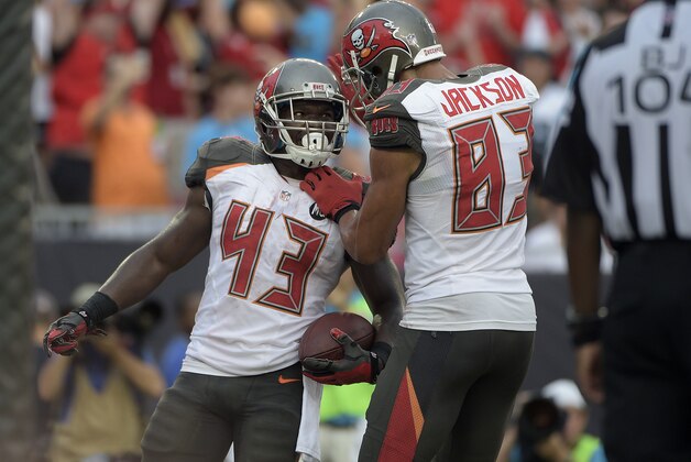 Tampa Bay Buccaneers running back Bobby Rainey (43) celebrates with wide receiver Vincent Jackson (83) after scoring against the Carolina Panthers during the fourth quarter of an NFL football game Sunday, Sept. 7, 2014, in Tampa, Fla. (AP Photo/Phelan M. Ebenhack)