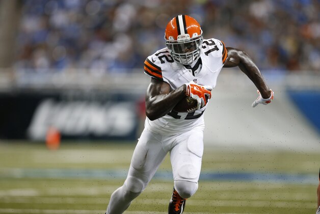 Cleveland Browns wide receiver Josh Gordon (12) runs with the ball against the Detroit Lions in the first half of a preseason NFL football game at Ford Field in Detroit, Saturday, Aug. 9, 2014.  (AP Photo/Rick Osentoski)