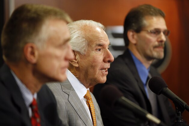 Philadelphia Flyers chairman Ed Snider, center, answers a reporter's question during an NHL hockey news conference with new general manager Ron Hextall, right, and new president Paul Holmgren, Wednesday, May 7, 2014, in Philadelphia. (AP Photo/Matt Slocum)