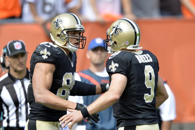 New Orleans Saints tight end Jimmy Graham (80) is congratulated by quarterback Drew Brees (9) after they connected on a 9-yard touchdown against the Cleveland Browns in the second quarter of an NFL football game Sunday, Sept. 14, 2014, in Cleveland. (AP Photo/David Richard)