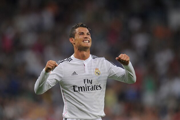MADRID, SPAIN - AUGUST 25:  Cristiano Ronaldo of Real Madrid celebrates after scoring Real's 2nd goal during the La liga match between Real Madrid CF and Cordoba CF at Estadio Santiago Bernabeu on August 25, 2014 in Madrid, Spain.  (Photo by Denis Doyle/Getty Images)