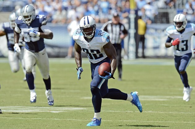Tennessee Titans tight end Delanie Walker (82) runs for a touchdown on a 61-yard pass play against the Dallas Cowboys in the third quarter of an NFL football game Sunday, Sept. 14, 2014, in Nashville, Tenn. (AP Photo/Mark Zaleski)