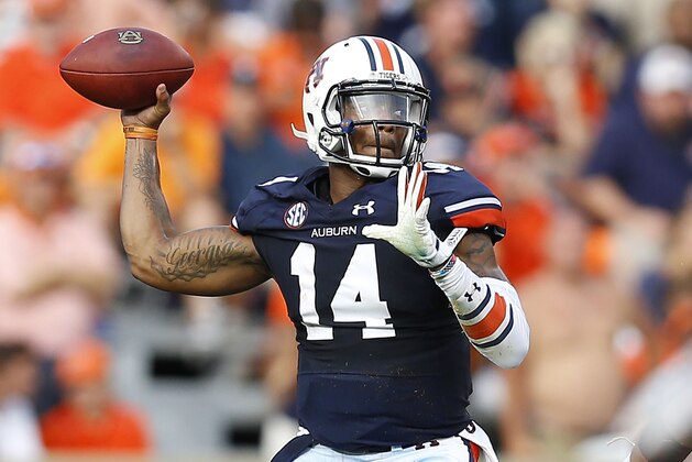 AUBURN, AL - AUGUST 30:  Quarterback Nick Marshall #14 of the Auburn Tigers throws a pass during the game against the Arkansas Razorbacks at Jordan Hare Stadium on August 30, 2014 in Auburn, Alabama.  (Photo by Mike Zarrilli/Getty Images)