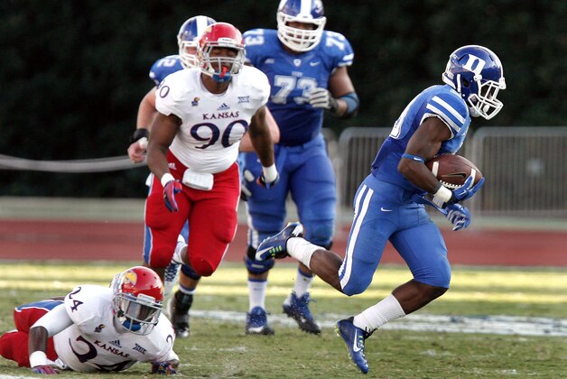 Sep 13, 2014; Durham, NC, USA; Duke Blue Devils running back Shaun Wilson (29) breaks away from the Kansas Jayhawks for one of his three touchdowns at Wallace Wade Stadium. Mandatory Credit: Mark Dolejs-USA TODAY Sports