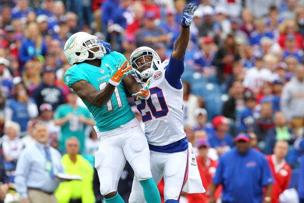Buffalo Bills cornerback Corey Graham (20) breaks up a pass intended for Miami Dolphins wide receiver Mike Wallace (11) during the first half of an NFL football game on Sunday, Sept. 14, 2014, in Orchard Park, N.Y. (AP Photo/Bill Wippert)