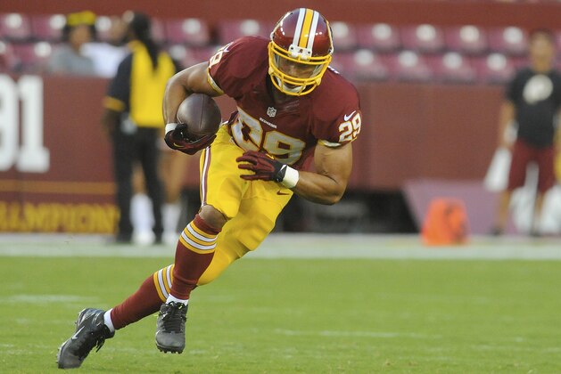Washington Redskins running back Roy Helu carries the ball during the first half of an NFL football preseason game against the New England Patriots in Landover, Md., Thursday, Aug. 7, 2014. (AP Photo/Richard Lipski)