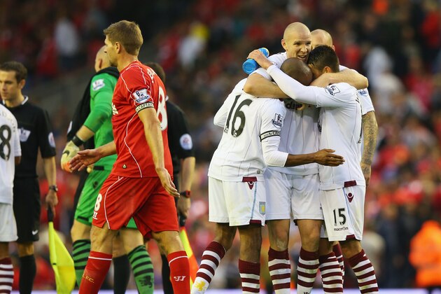 LIVERPOOL, ENGLAND - SEPTEMBER 13: Philippe Senderos of Aston Villa celebrates victory with team mates after the Barclays Premier League match between Liverpool and Aston Villa at Anfield on September 13, 2014 in Liverpool, England.  (Photo by Alex Livesey/Getty Images)
