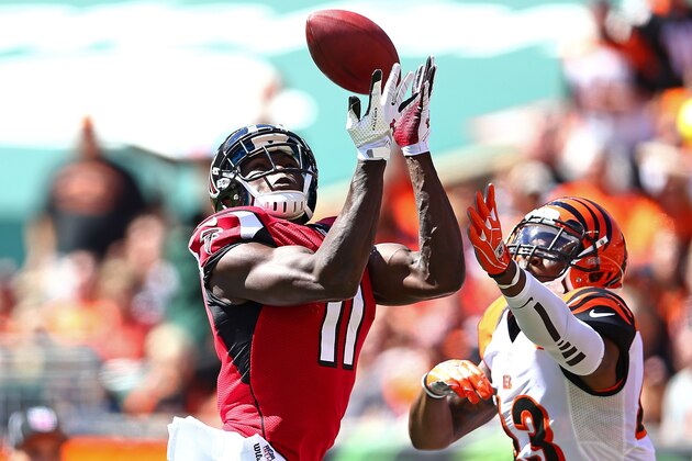 CINCINNATI, OH - SEPTEMBER 14:  Julio Jones #11 of the Atlanta Falcons and George Iloka #43 of the Cincinnati Bengals both attempt to catch a pass during the second quarter at Paul Brown Stadium on September 14, 2014 in Cincinnati, Ohio. The play resulted in an incomplete pass. (Photo by Andy Lyons/Getty Images)
