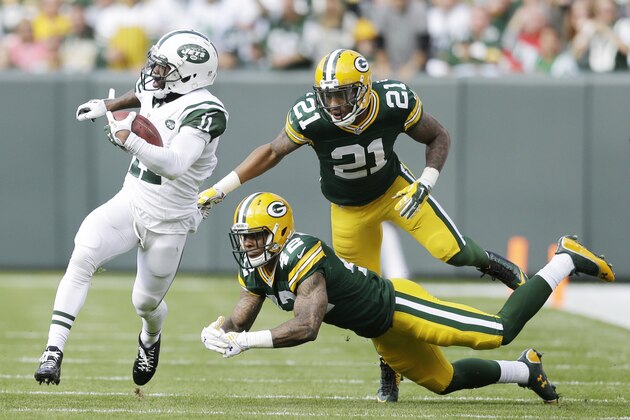 New York Jets' Jeremy Kerley gets past Green Bay Packers' Morgan Burnett (42) and Ha Ha Clinton-Dix (21) on a reception during the first half of an NFL football game Sunday, Sept. 14, 2014, in Green Bay, Wis. (AP Photo/Tom Lynn)