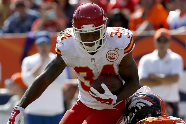 Kansas City Chiefs running back Knile Davis (34) runs as Denver Broncos outside linebacker Von Miller (58) makes the tackle during the first half of an NFL football game, Sunday, Sept. 14, 2014, in Denver. (AP Photo/Joe Mahoney)