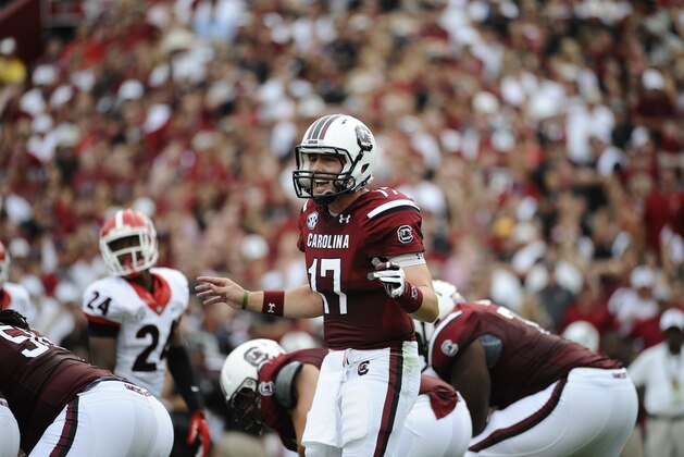 South Carolina quarterback Dylan Thompson (17) gestures at the line of scrimmage against Georgia during the first half of an NCAA college football game on Saturday, Sept. 13, 2014, in Columbia, S.C. South Carolina won 38-35. (AP Photo/Rainier Ehrhardt)