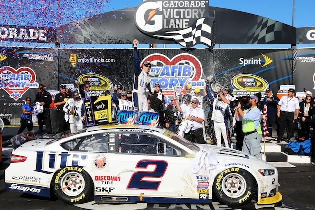 JOLIET, IL - SEPTEMBER 14:  Brad Keselowski, driver of the #2 Miller Lite Ford, celebrates in Victory Lane after winning during the NASCAR Sprint Cup Series MyAFibStory.com 400 at Chicagoland Speedway on September 14, 2014 in Joliet, Illinois.  (Photo by Jerry Markland/Getty Images)