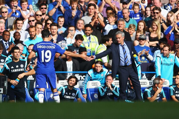 LONDON, ENGLAND - SEPTEMBER 13:  Hat trick scorer Diego Costa of Chelsea shakes hands with Jose Mourinho manager of Chelsea during the Barclays Premier League match between Chelsea and Swansea City at Stamford Bridge on September 13, 2014 in London, England.  (Photo by Paul Gilham/Getty Images)