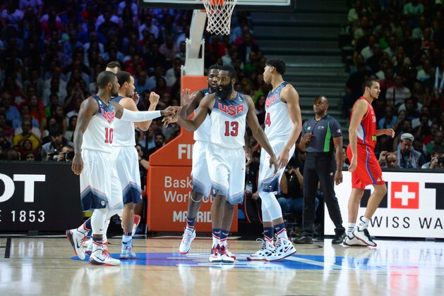 MADRID, SPAIN - SEPTEMBER 14: Kyrie Irving #10 and James Harden #13 of the USA Men's National Team high fives against the Serbia National Team during the 2014 FIBA World Cup Finals at Palacio de Deportes on September 14, 2014 in Madrid, Spain.  NOTE TO USER: User expressly acknowledges and agrees that, by downloading and/or using this Photograph, user is consenting to the terms and conditions of the Getty Images License Agreement. Mandatory Copyright Notice: Copyright 2014 NBAE (Photo by Jesse D. Garrabrant/NBAE via Getty Images)