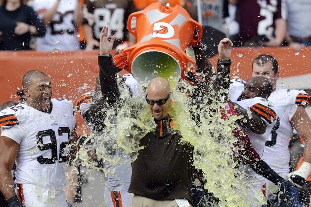 Cleveland Browns players douse head coach Mike Pettine after a 26-24 win over the New Orleans Saints in an NFL football game Sunday, Sept. 14, 2014, in Cleveland. (AP Photo/David Richard)
