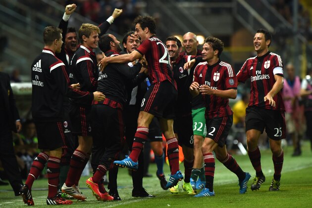 PARMA, ITALY - SEPTEMBER 14:  Giacomo Bonaventura (C) of AC Milan celebrates the opening goal with team mates during the Serie A match between Parma FC and AC Milan at Stadio Ennio Tardini on September 14, 2014 in Parma, Italy.  (Photo by Valerio Pennicino/Getty Images)