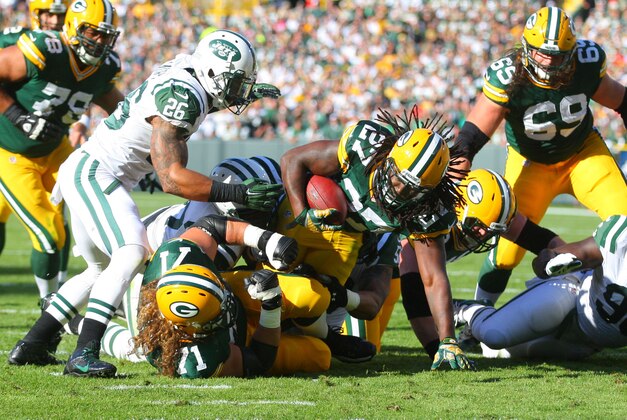 Sep 14, 2014; Green Bay, WI, USA; Green Bay Packers running back Eddie Lacy (27) runs with the ball during the second quarter of a game against the New York Jets at Lambeau Field. Mandatory Credit: Dennis Wierzbicki-USA TODAY Sports