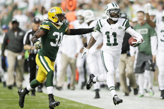 Green Bay Packers' Davon House knocks New York Jets' Jeremy Kerley out of bounds after a catch during the first half of an NFL football game Sunday, Sept. 14, 2014, in Green Bay, Wis. (AP Photo/Tom Lynn)