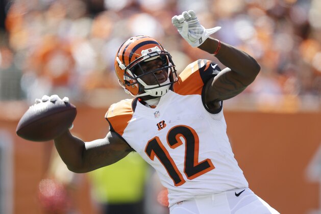 Cincinnati Bengals wide receiver Mohamed Sanu throws a 50-yard pass in the first half of an NFL football game against the Atlanta Falcons, Sunday, Sept. 14, 2014, in Cincinnati. (AP Photo/Michael Conroy)